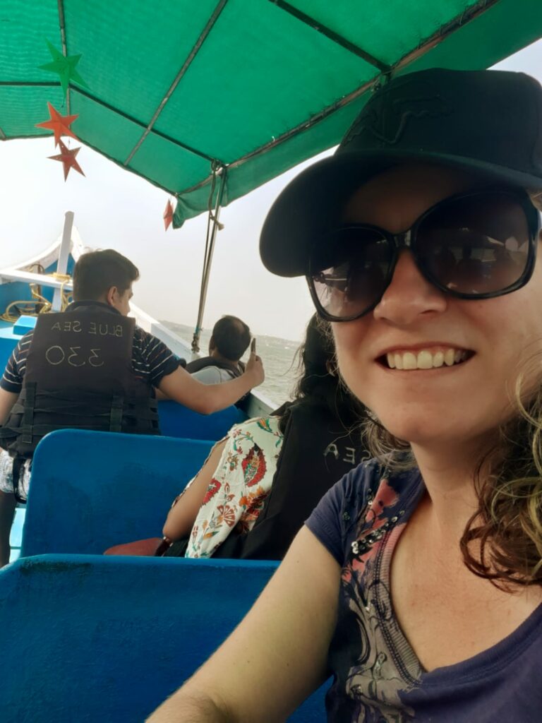 Claire on a boat in Goa