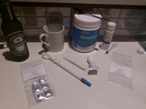 Pic of bevy of medication and stray Heinekin on the benchtop